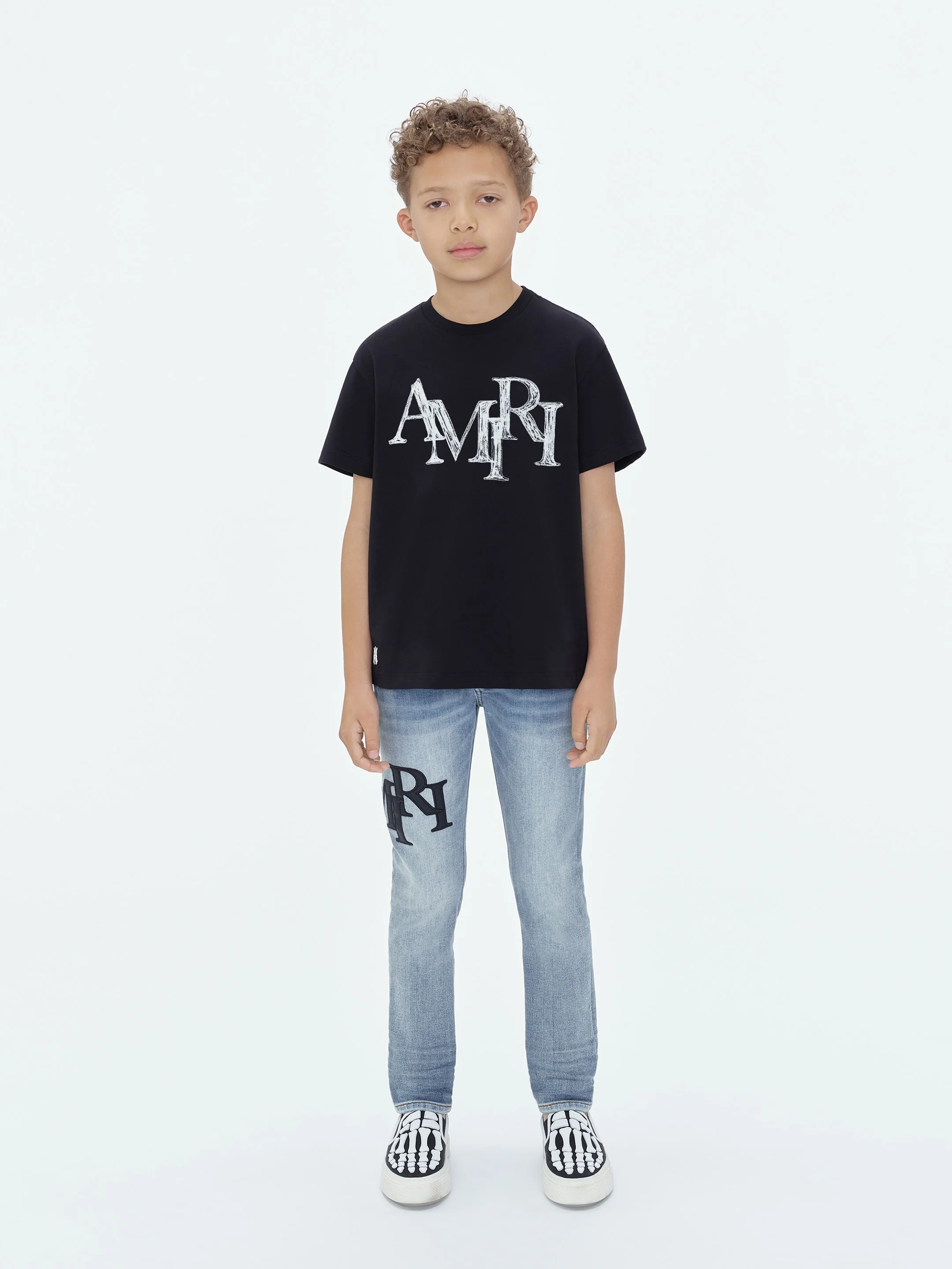 4273-kids-amiri-staggered-scribble-tee-black-1.webp KIDS - AMIRI STAGGERED SCRIBBLE TEE - Black